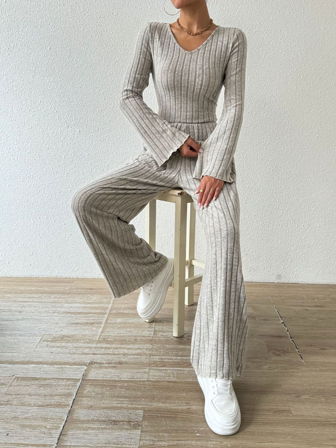 Flared ribbed knit lounge set in Dust Storm with v-neck top and wide-leg pants.