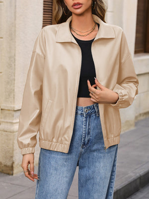 Tan faux leather bomber jacket with zip front and elastic cuffs and hem.