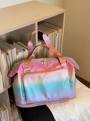 Iridescent gradient large duffel bag with pink straps and front pocket.
