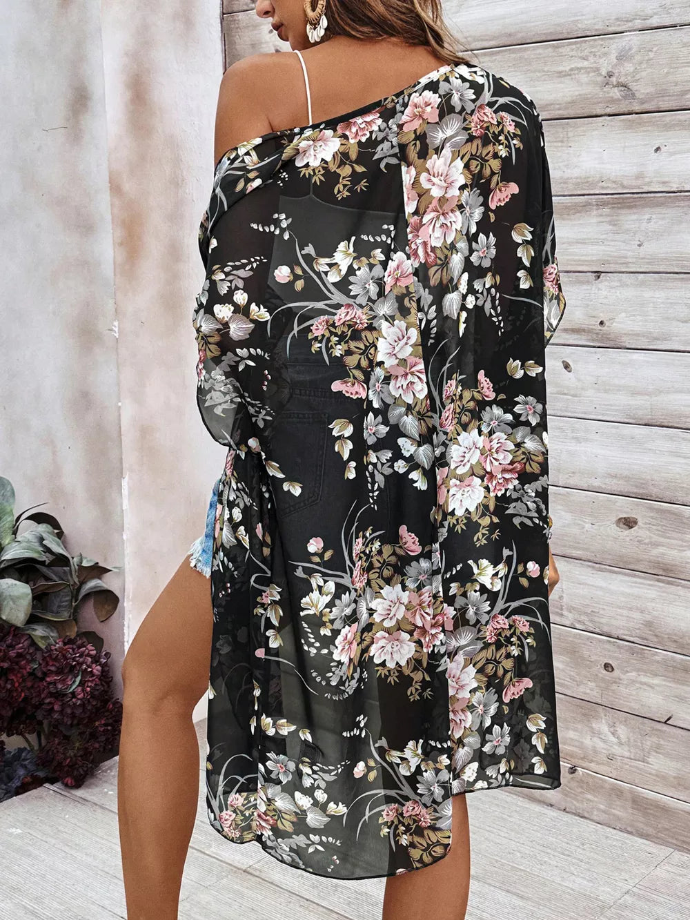 Sheer black floral print lightweight cardigan with open front and long sleeves.