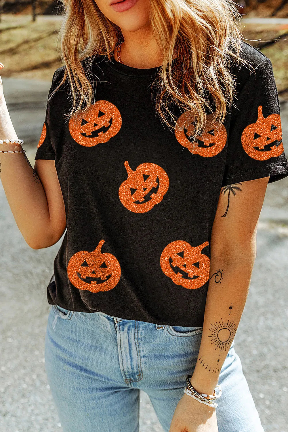 Black cotton t-shirt with allover glitter pumpkin print