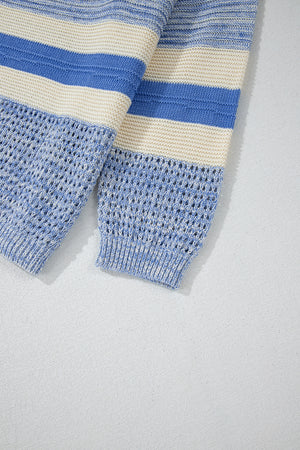 Light blue striped knit sweater with eyelet yoke detail and ribbed cuffs.