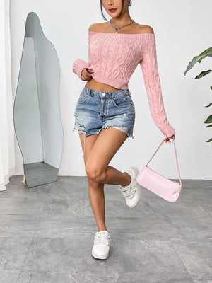 Blush pink cable knit cropped off-the-shoulder sweater with long sleeves.