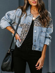 Distressed denim trucker jacket with leopard print panels and button front.