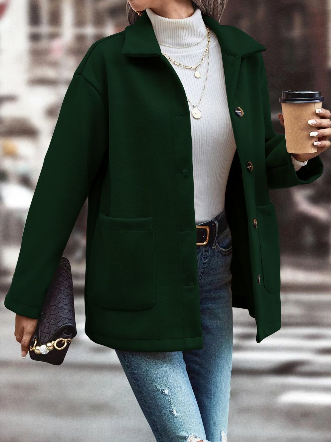 Oversized green shirt jacket with flap pockets, collared neckline, and button front.