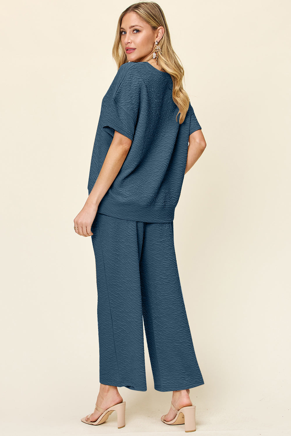 Textured cocoon top and wide leg pants set in a deep blue hue.