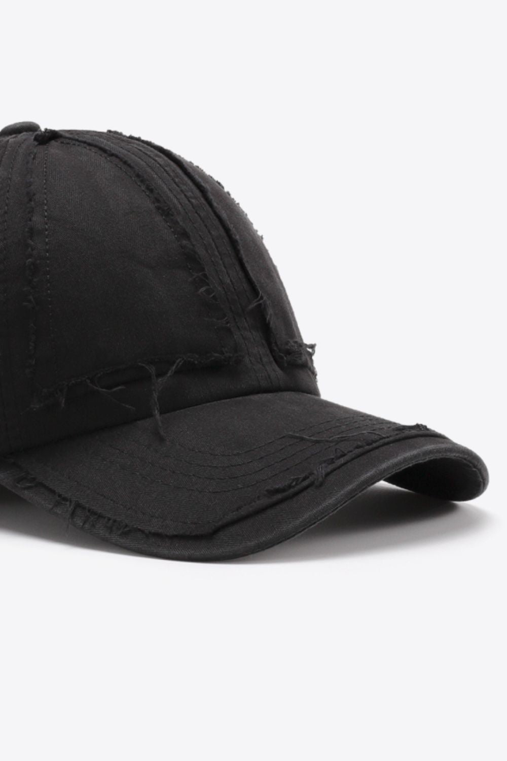 Black denim baseball cap with raw edge detailing and distressed accents.