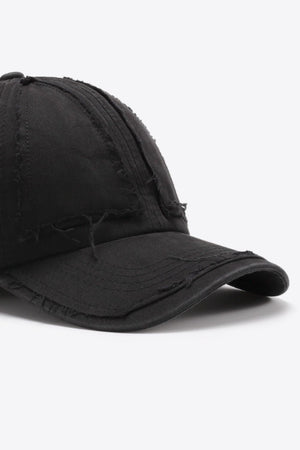 Black denim baseball cap with raw edge detailing and distressed accents.