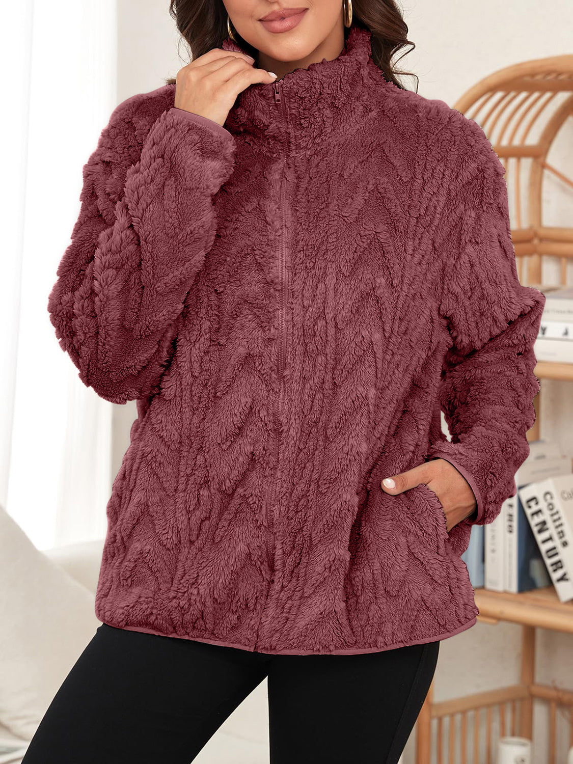 Burgundy textured chevron fleece zip jacket with stand-up collar and pockets.