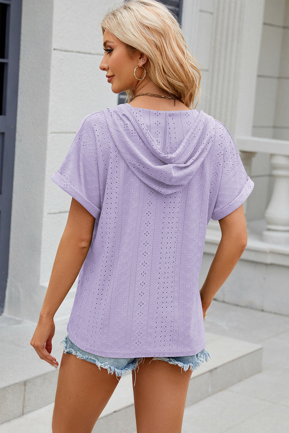 Lavender perforated hooded tee with short sleeves and a casual fit.