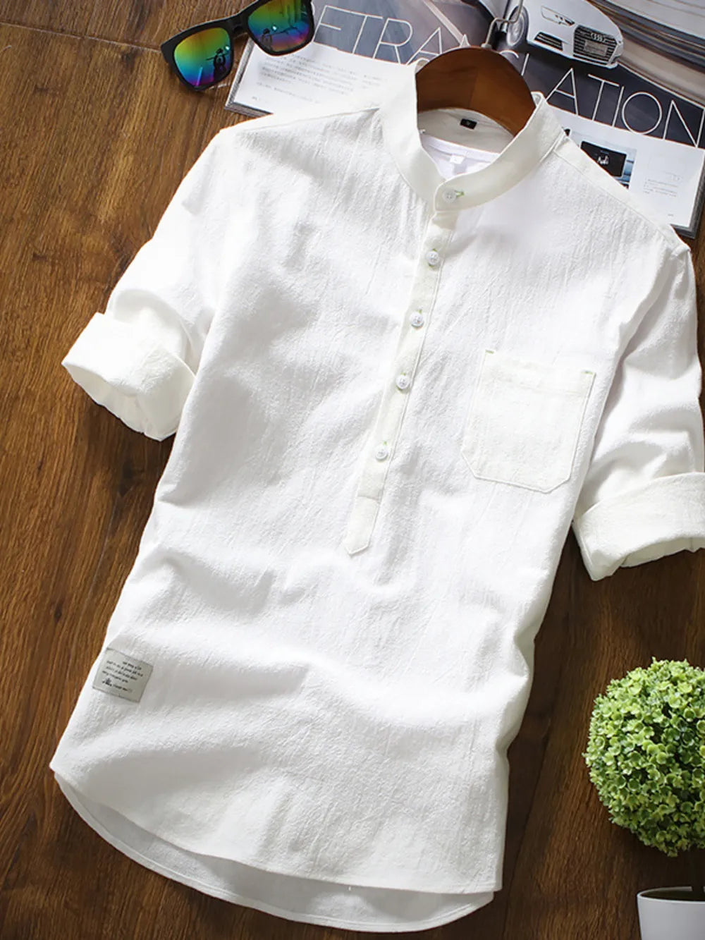 White casual cotton shirt with Mandarin collar and 3/4 sleeves, featuring a chest pocket.