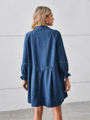 Denim shirtdress in dark blue with ruffled cuff sleeves and a gathered skirt.