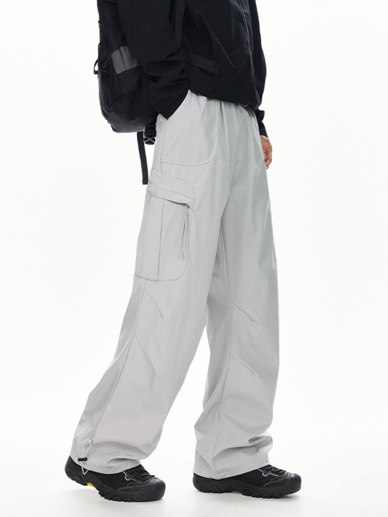 Men's light gray relaxed fit cargo sweatpants with adjustable drawstring hems.