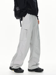 Men's light gray relaxed fit cargo sweatpants with adjustable drawstring hems.