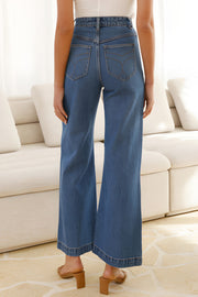 Sailor-inspired wide-leg denim trousers in medium wash with a flared hem.