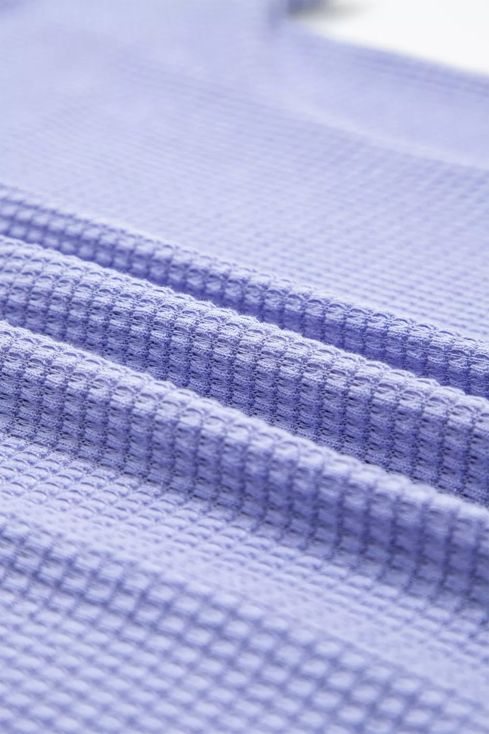 Relaxed V-neck waffle knit t-shirt in Blue Purple, showing textured fabric detail.