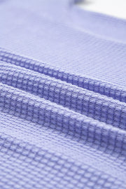 Relaxed V-neck waffle knit t-shirt in Blue Purple, showing textured fabric detail.