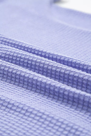 Relaxed V-neck waffle knit t-shirt in Blue Purple, showing textured fabric detail.