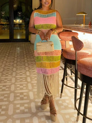 Vibrant color block knit maxi dress with fringe and a leg slit, sleeveless, crew neck.