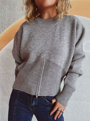 Gray ribbed zip-front knit sweater with a mock neck and ribbed hemline