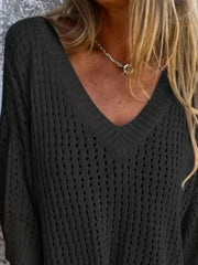 Black open-knit V-neck sweater with relaxed fit and breathable texture.