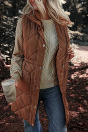 Brown diamond quilted longline vest with drawstring waist detail and snap closures