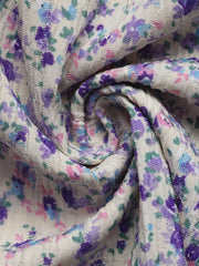 Floral lace-up cami maxi dress in textured fabric with purple, blue, and pink floral print.
