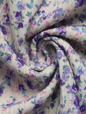 Floral lace-up cami maxi dress in textured fabric with purple, blue, and pink floral print.