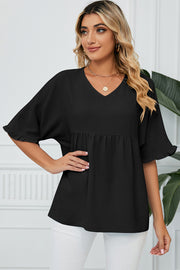 Black v-neck blouse with gathered yoke and flutter sleeves