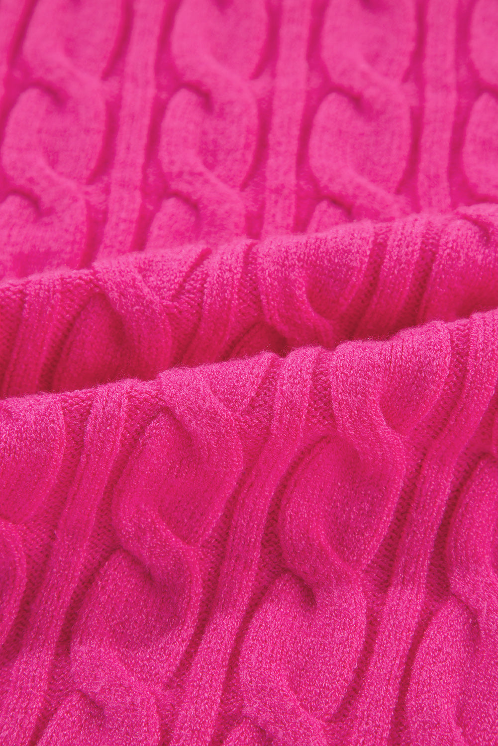 Hot pink cable knit sweater with a mock neck detail.