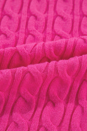 Hot pink cable knit sweater with a mock neck detail.