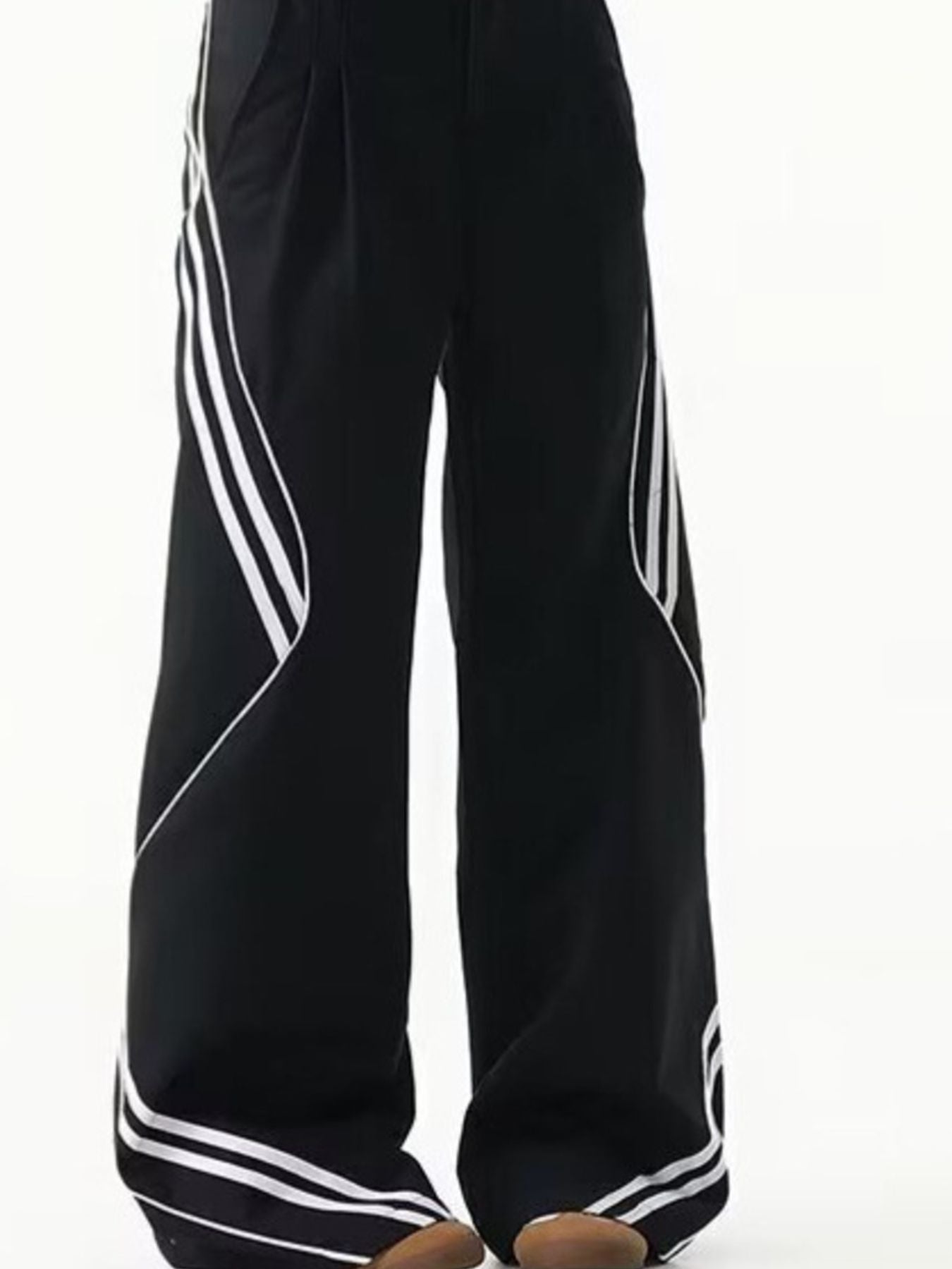 Men's black wide leg track pants with white stripe accents and a comfortable fit.