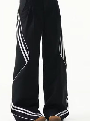 Men's black wide leg track pants with white stripe accents and a comfortable fit.