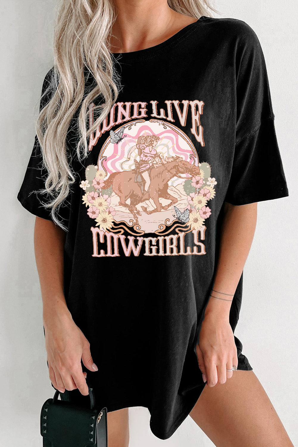Black graphic tee with a cowgirl riding a horse and floral design, "Long Live Cowgirls" text.