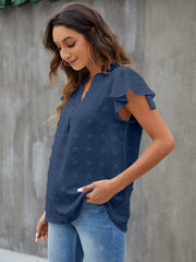 Dark blue textured voile blouse with flutter sleeves and V-neck.