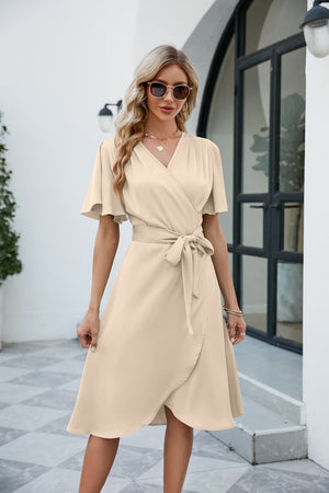 Beige polyester midi wrap dress with butterfly sleeves and adjustable tie waist.