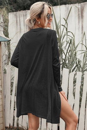Black button-down maxi cardigan with long sleeves and a relaxed fit.
