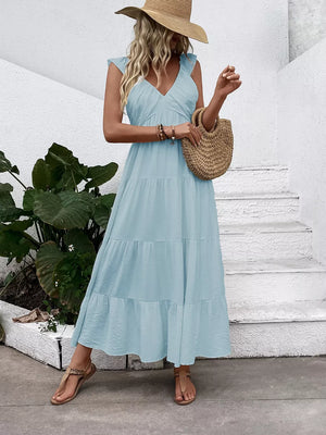 Light blue tiered maxi dress with flutter sleeves and V-neck.