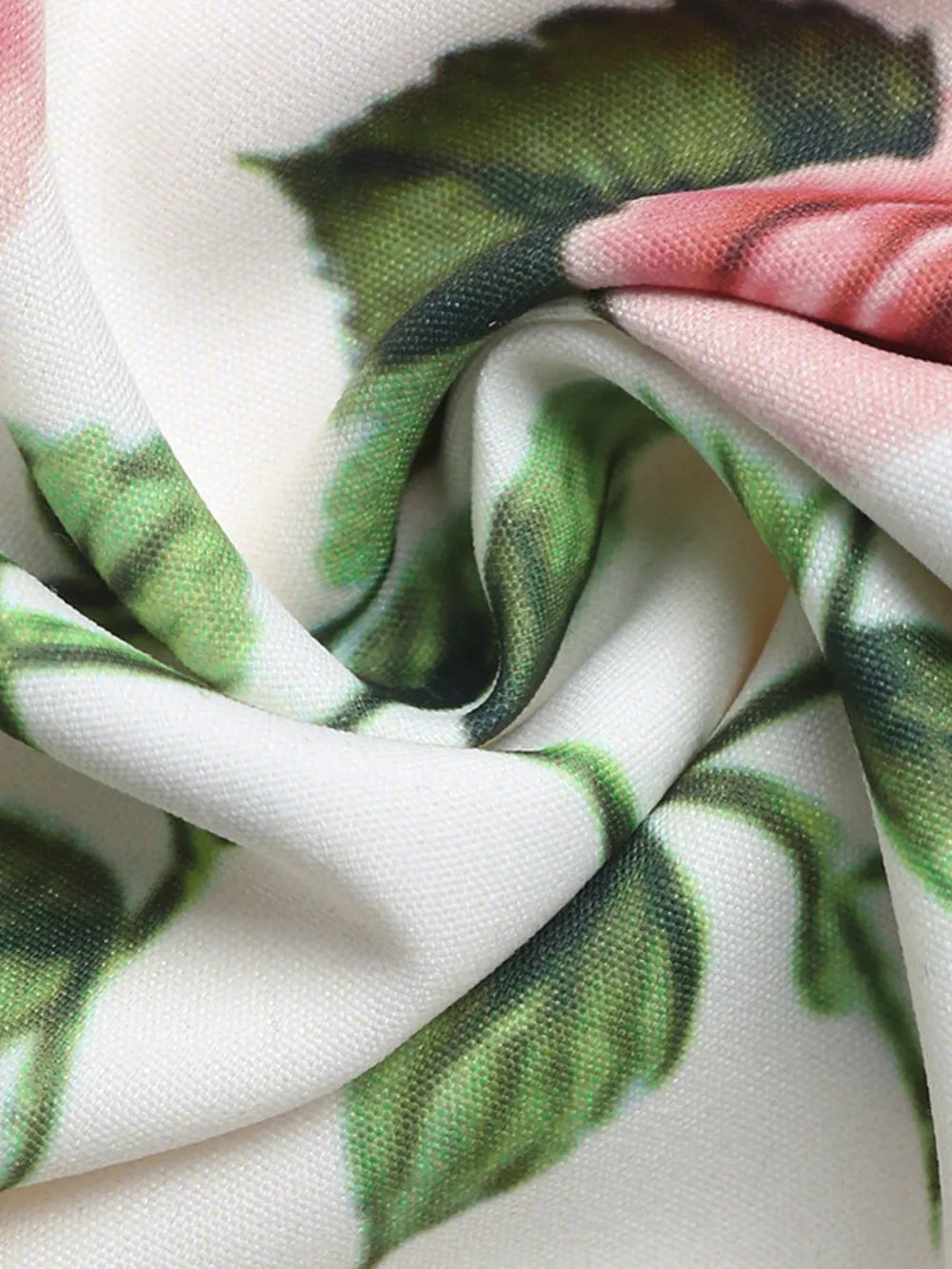 Elegant floral maxi skirt fabric detail with pink roses and green leaves on white.