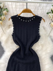 Black textured knit midi dress with pearl neckline and cutout details