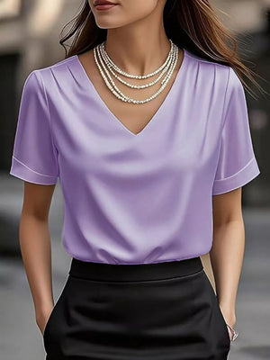 Light purple satin v-neck shirt with cuffed sleeves and subtle pleating.
