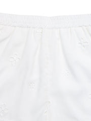 White embroidered shorts with elastic waistband and floral eyelet details.