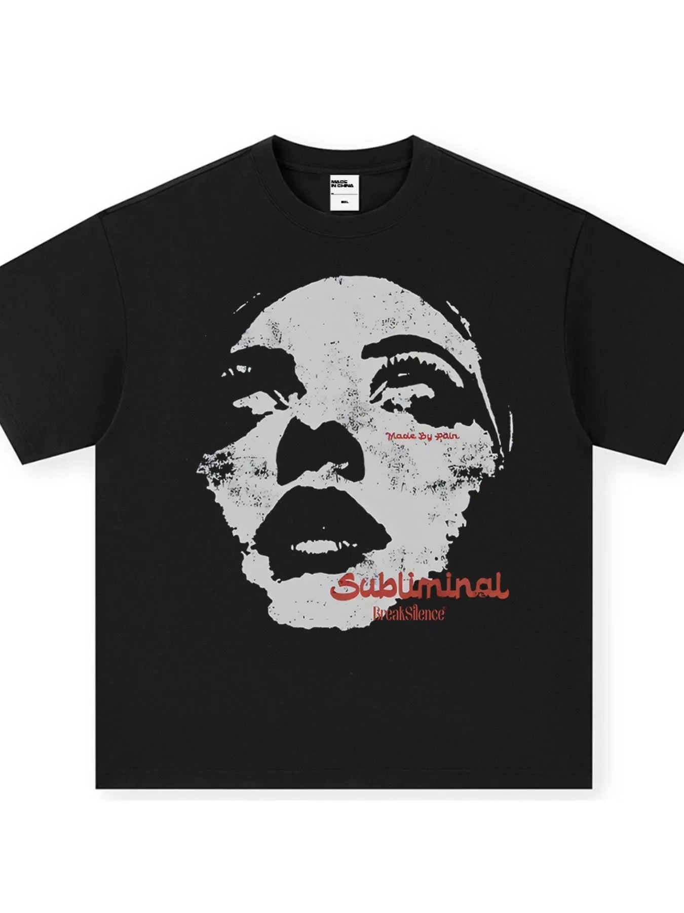 Black oversized graphic tee with a distressed face print and red "Subliminal Break Silence" text.