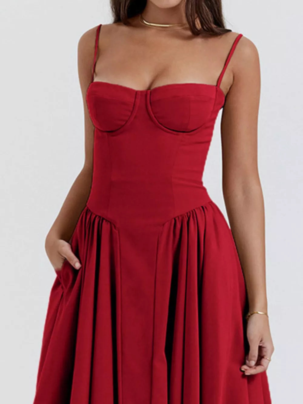 Deep red sweetheart midi dress with spaghetti straps and pockets.