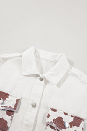 White denim shacket with cow print pockets and frayed edges