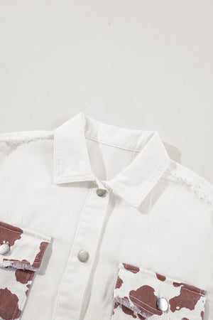 White denim shacket with cow print pockets and frayed edges