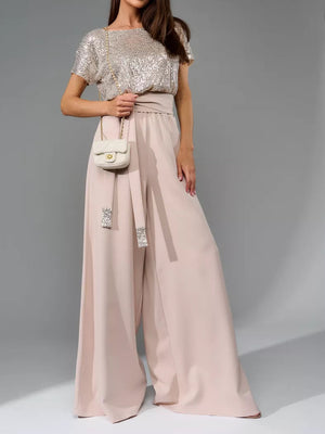 Sequin bodice and dusty pink palazzo pants with belted waist.