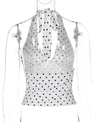 White polka dot halter cami with tie neck and cropped fit.