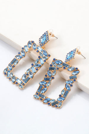 Geometric jewel box earrings with blue stones and gold alloy setting.