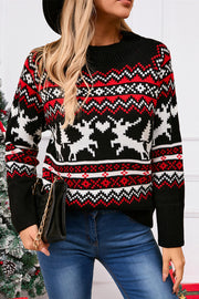 Black acrylic sweater with festive Fair Isle reindeer and geometric pattern, mock neck.